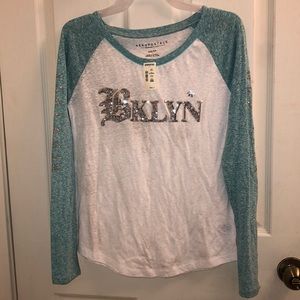 Selling a long sleeve shirt, new with tags on!